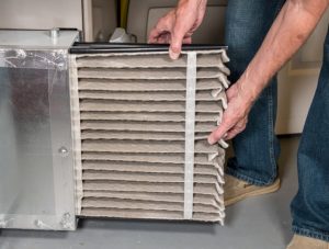 changing-dirty-air-filter-in-furnace